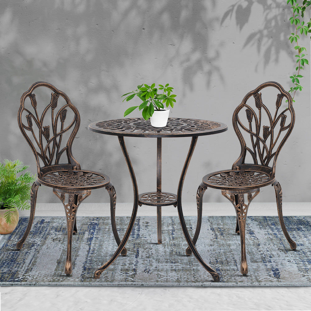Bronze cast aluminum bistro table with round mosaic top and two tulip-back chairs