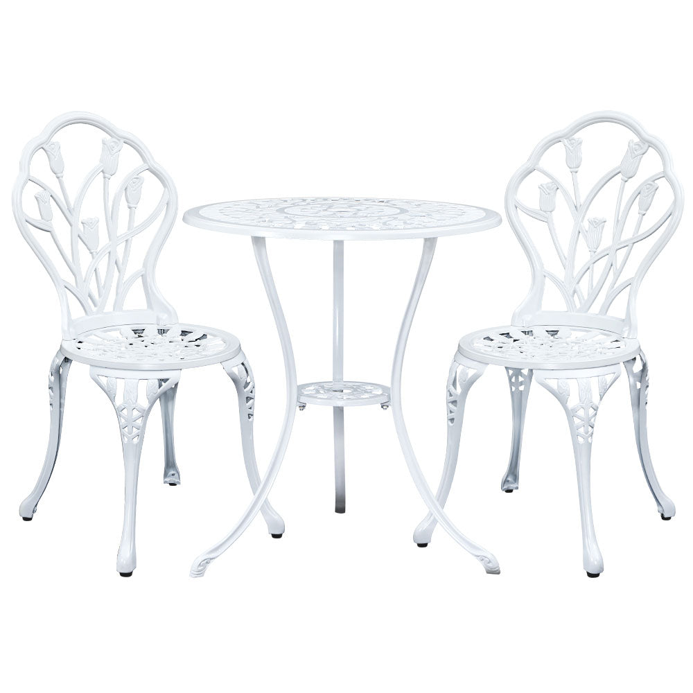 White bistro set with round table and two matching armchairs in a studio view