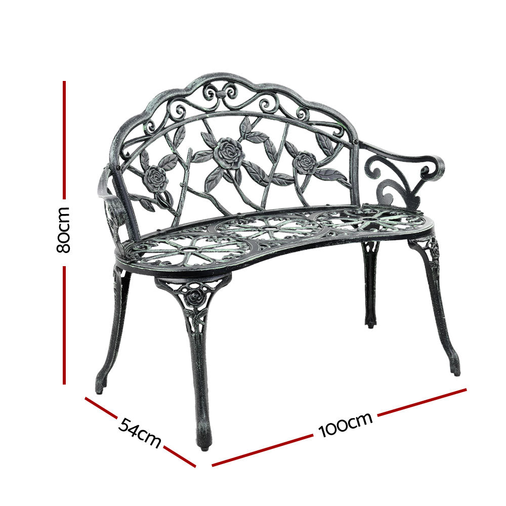 Cast aluminum garden bench seat with floral scrollwork, dark frame and green inlay
