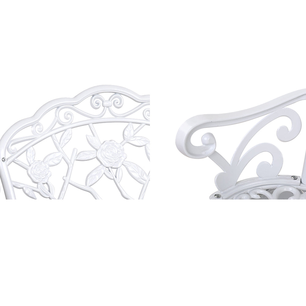 Vintage white cast aluminum bench with embossed floral back detail and scroll arm