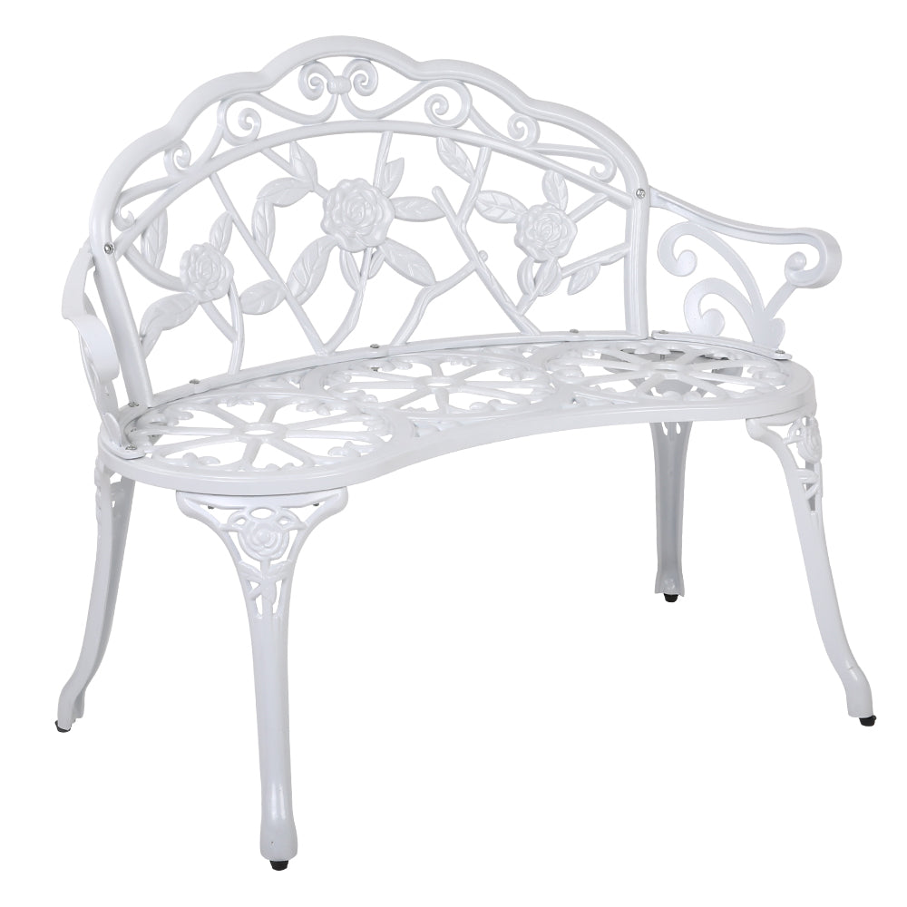 Vintage white cast aluminum bench chair with floral back lattice and curved arm scrolls