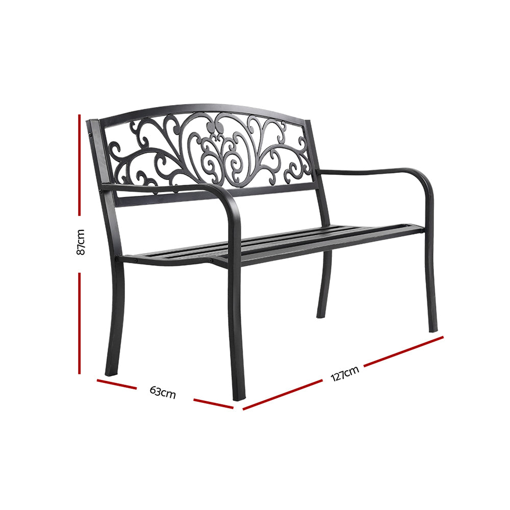 Black metal outdoor bench with arched armrests and scroll back, slatted seat