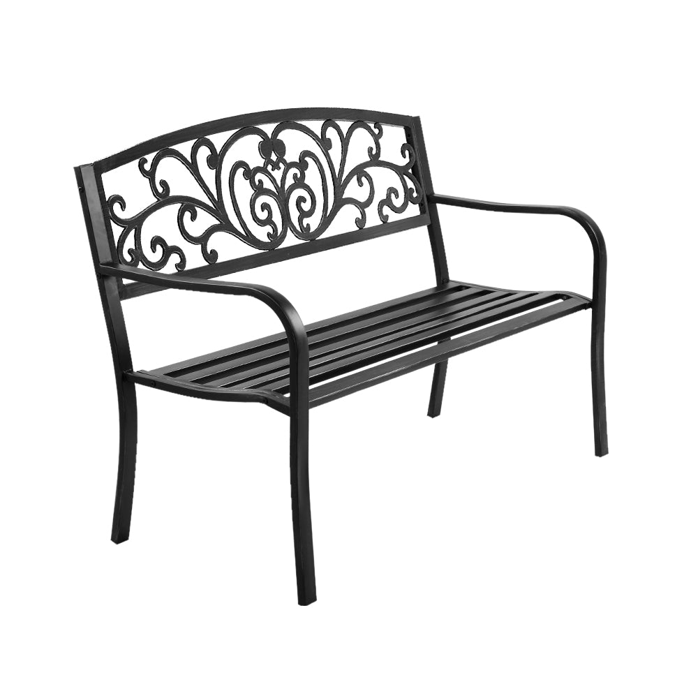 Black steel outdoor garden bench with decorative scroll backrest and slatted seat
