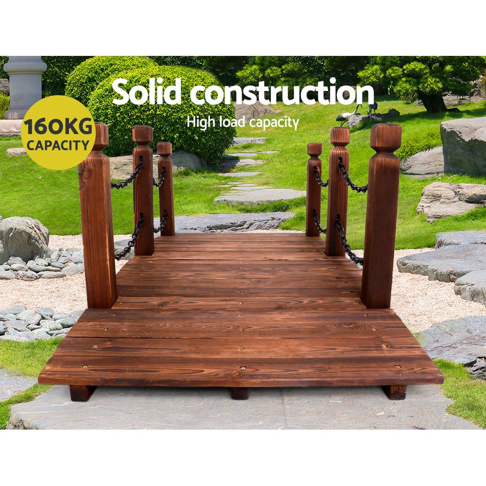 Wooden bridge outdoor ornament with vertical posts and chain railings, dark brown deck
