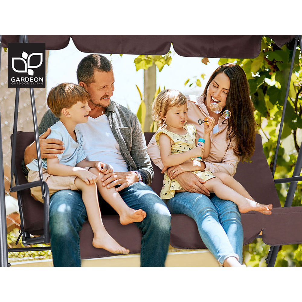 3-seater outdoor swing chair with brown canopy and cushioned bench, family seated