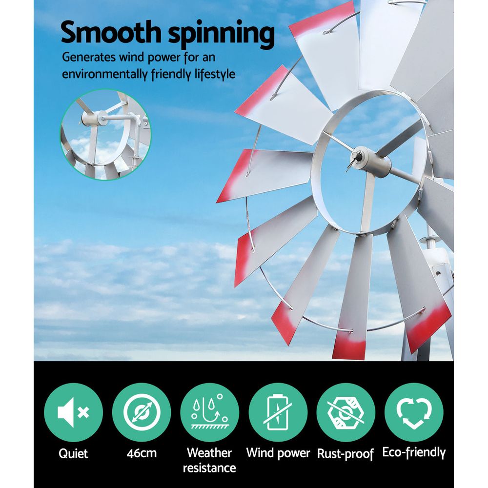 Metal wind spinner with red-and-white blades and central axle, outdoor weather decor