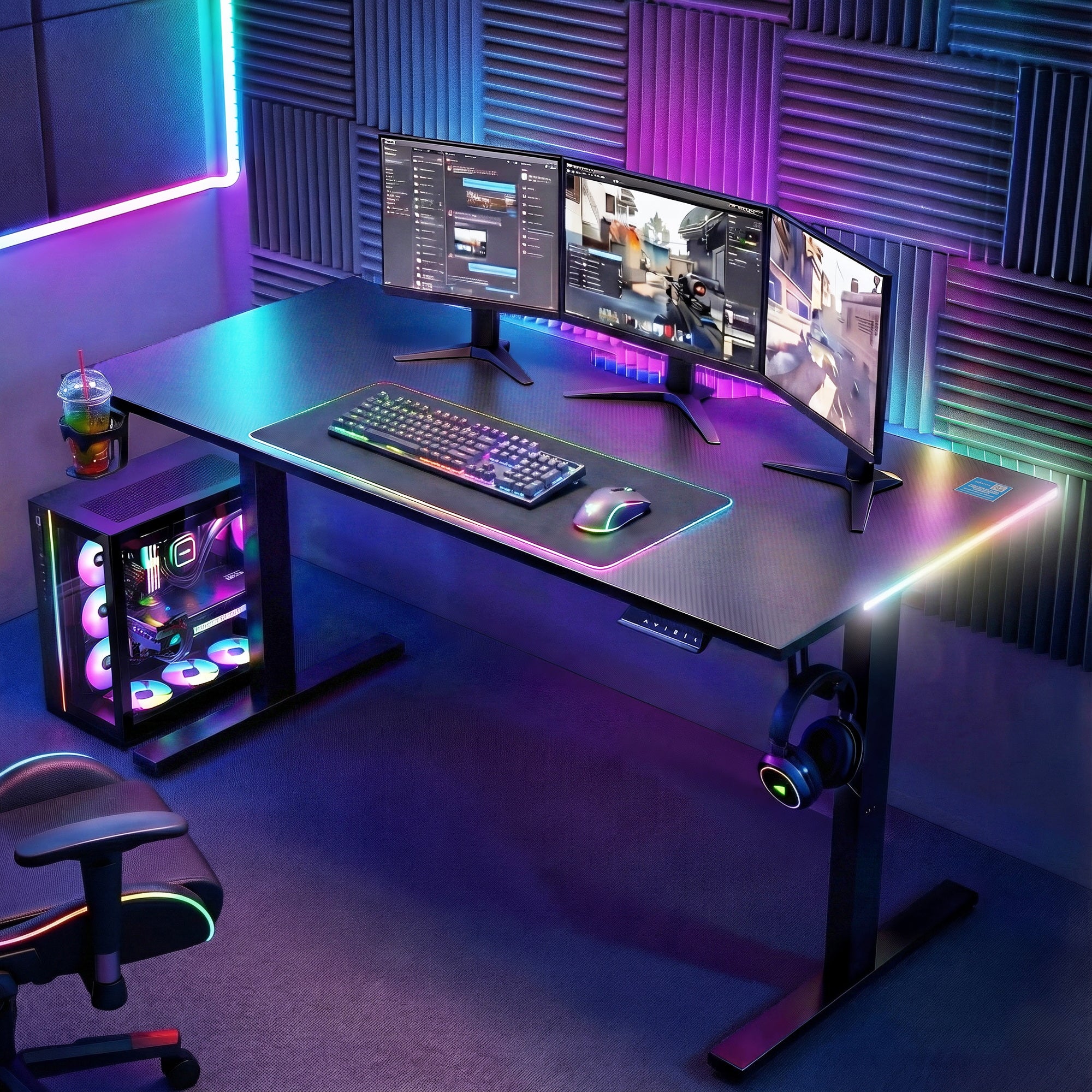 Black electric standing desk with dual monitors, keyboard, and RGB lighting accents