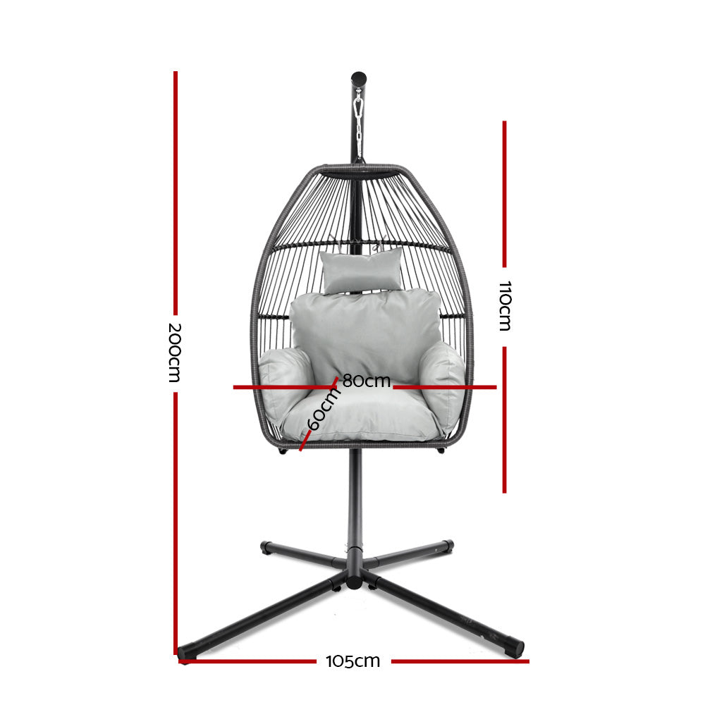 Egg swing chair with hanging oval seat, grey cushions, and cross-base stand