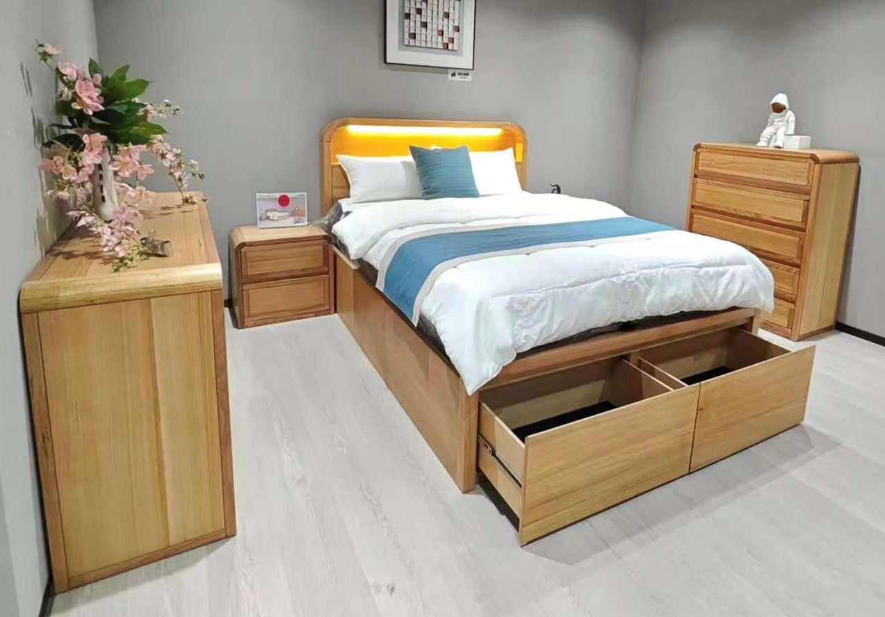 Wooden bedroom furniture set with bed, nightstands, and dresser in a room.