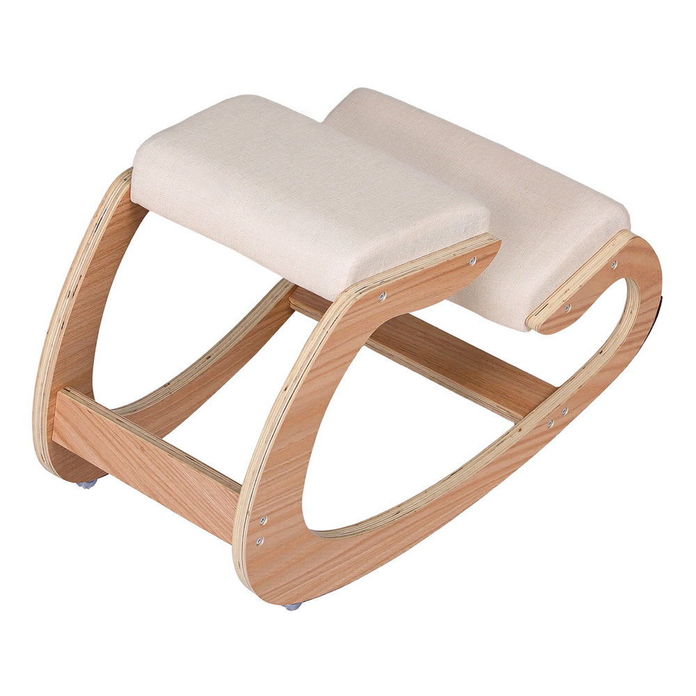 Beige ergonomic kneeling chair with thick kneeling pad and curved light-wood base
