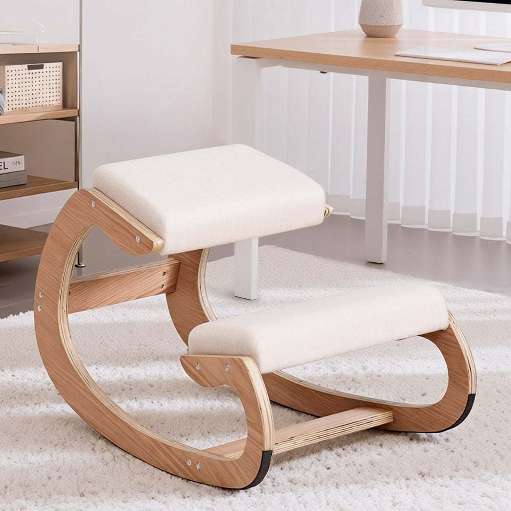 Beige kneeling chair with two padded cushions and curved light-wood bent base