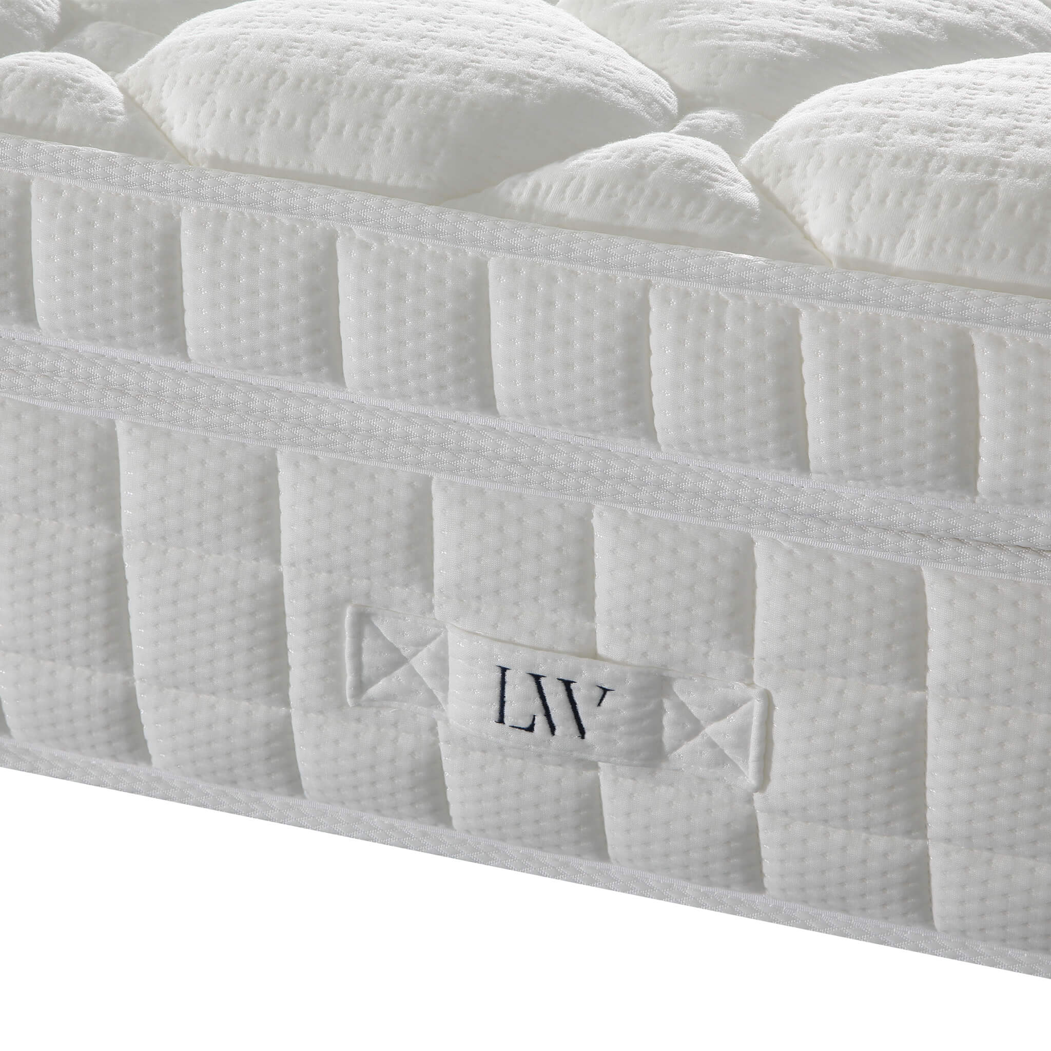 White mattress side panel close-up with LIV logo and vertical stitched channels