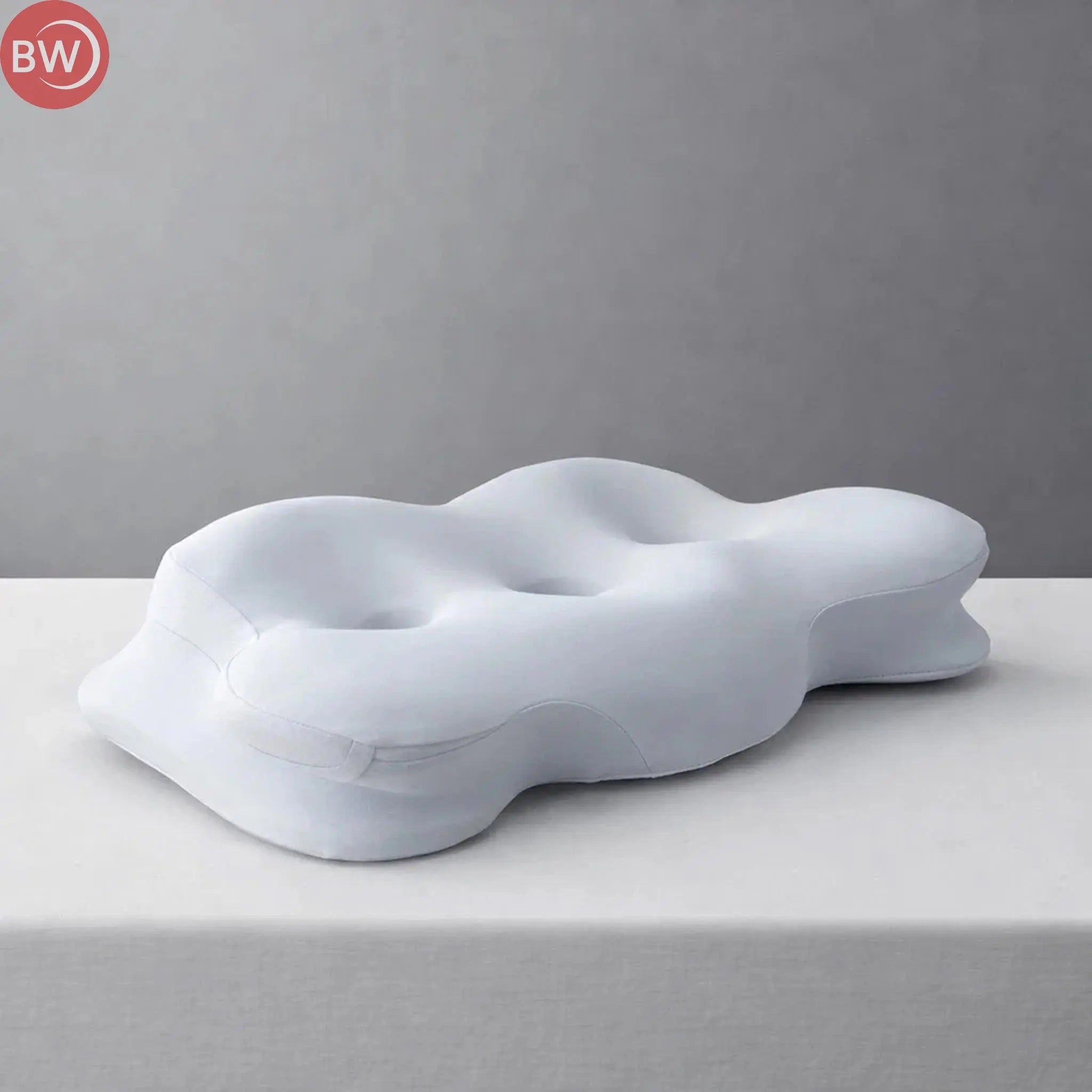 Light blue balance pillow with molded depressions and smooth curved sides