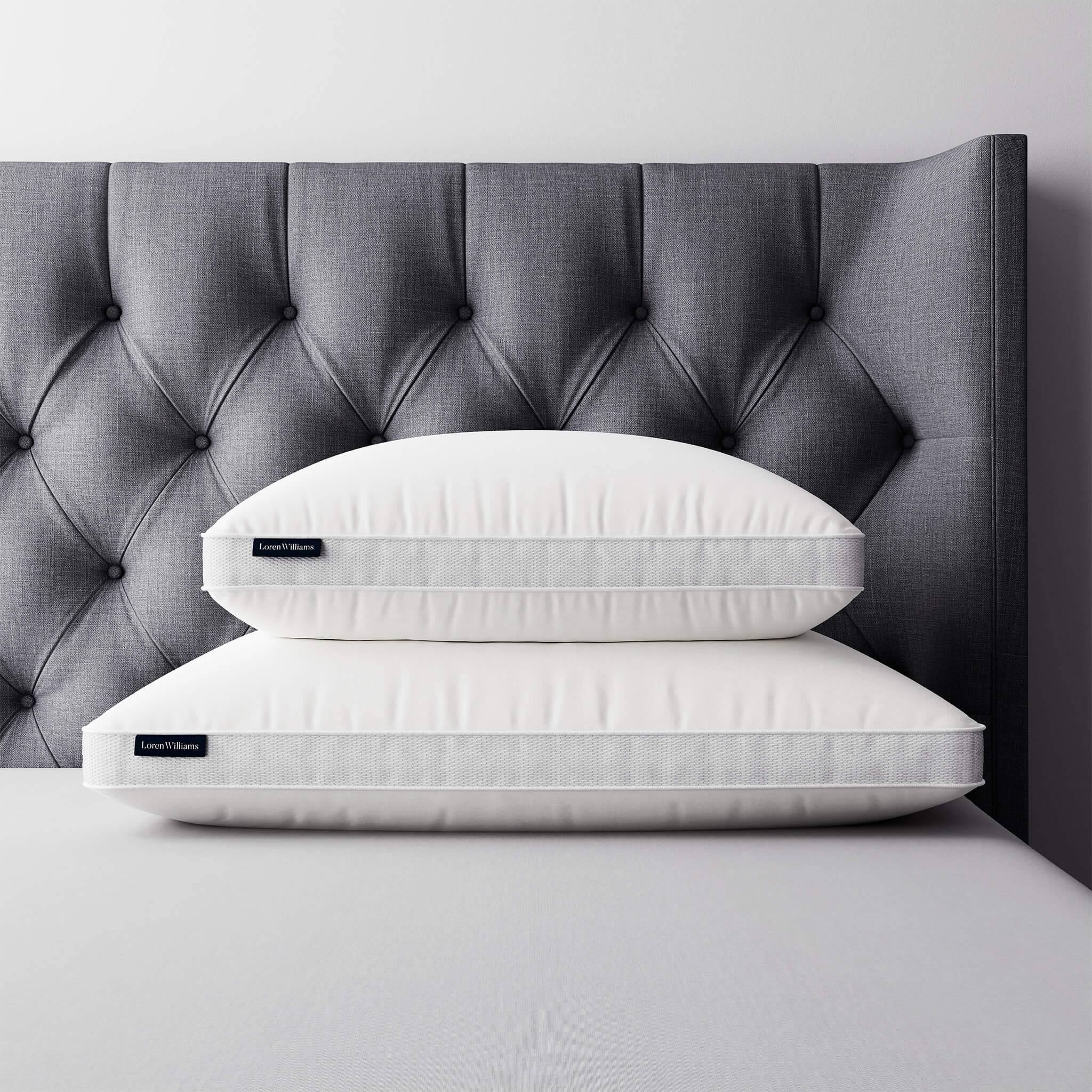 Loren Williams Pocket Pillow styled on modern bed 