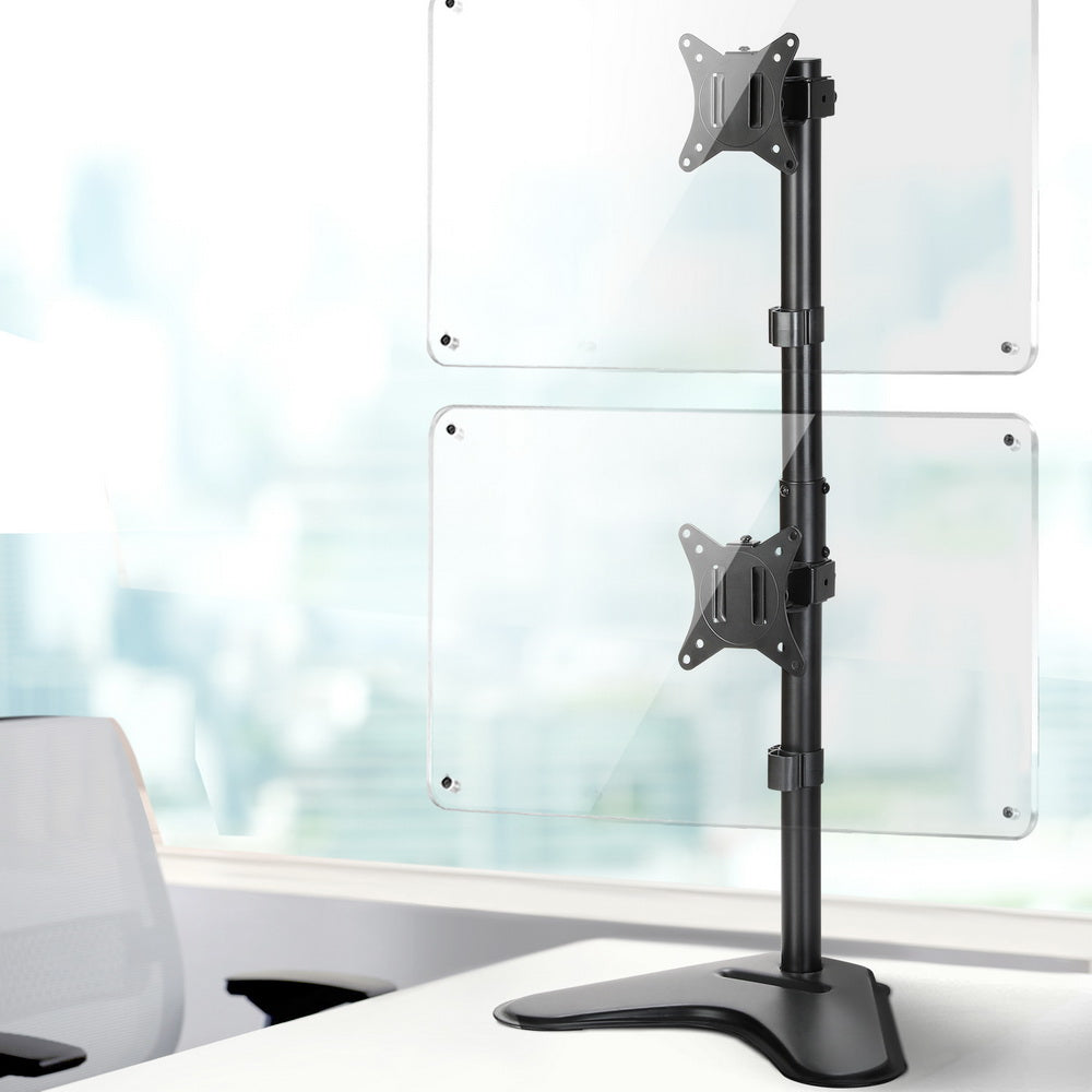 Dual monitor arm stand mounted on window glass with two VESA plates and black base
