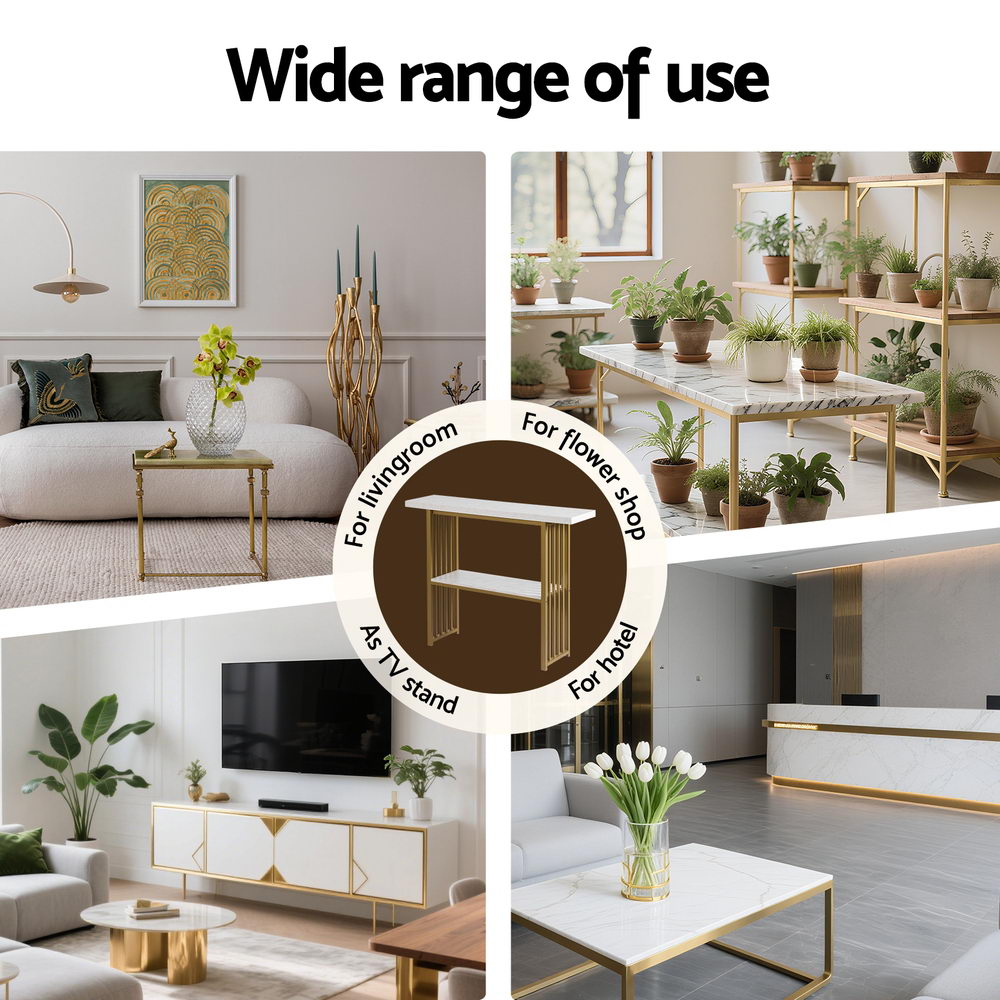 Gold console table with marble-effect top, styled with flowers and decor
