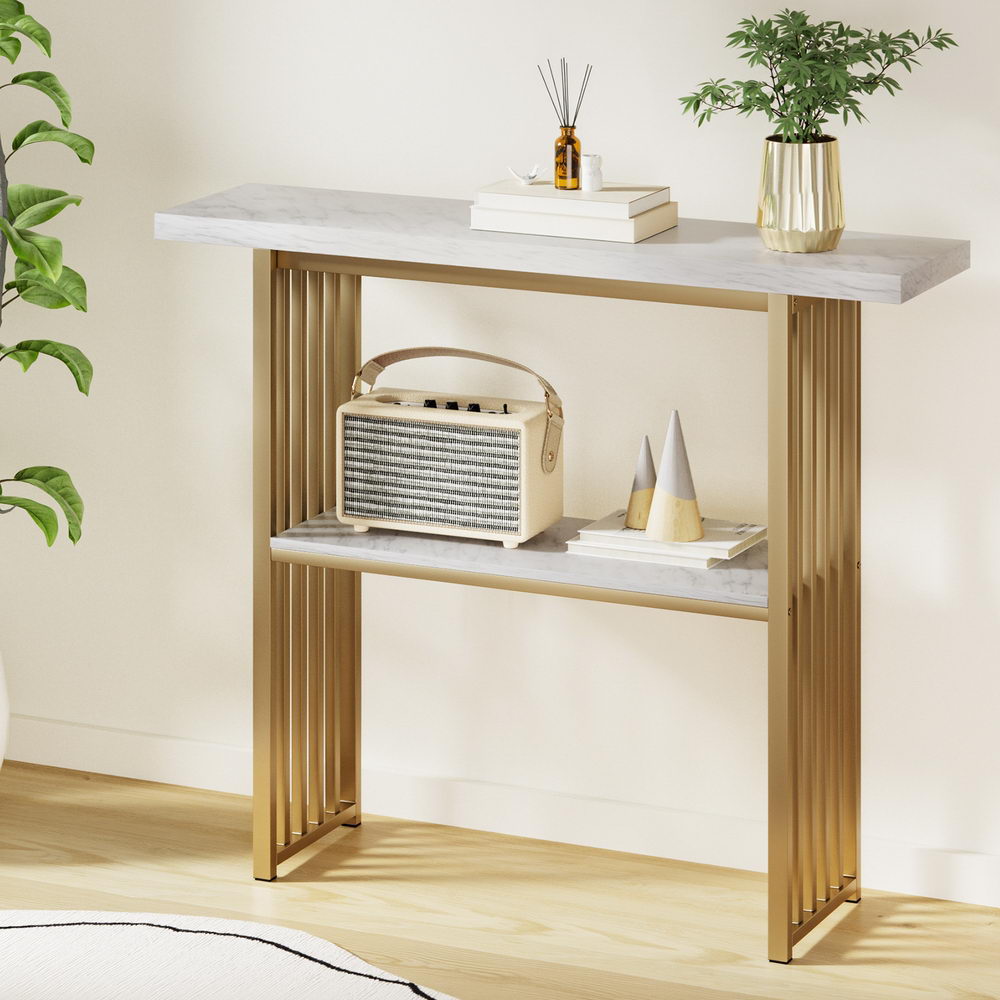 Marble-effect console table with white top and gold frame, open two-tier shelves