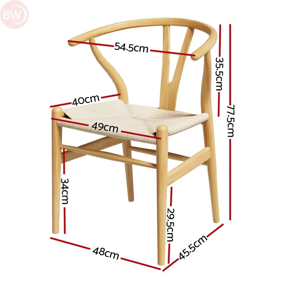 Wood dining chair with wishbone back and beige upholstered seat, side view