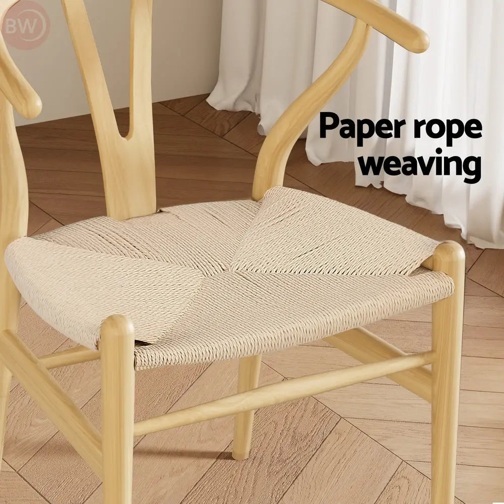 Beige paper-rope woven chair seat on light wood frame with curved legs