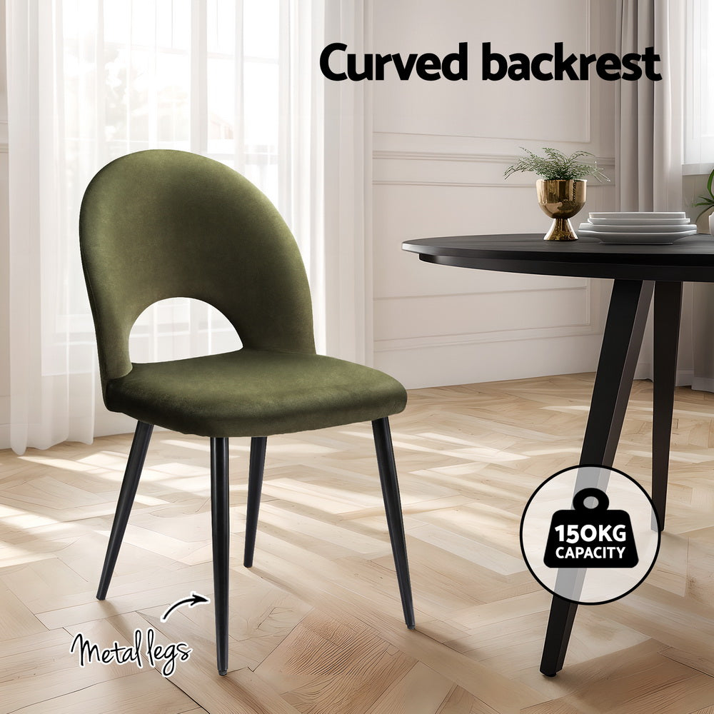 Olive green velvet dining chair with curved backrest and black metal legs