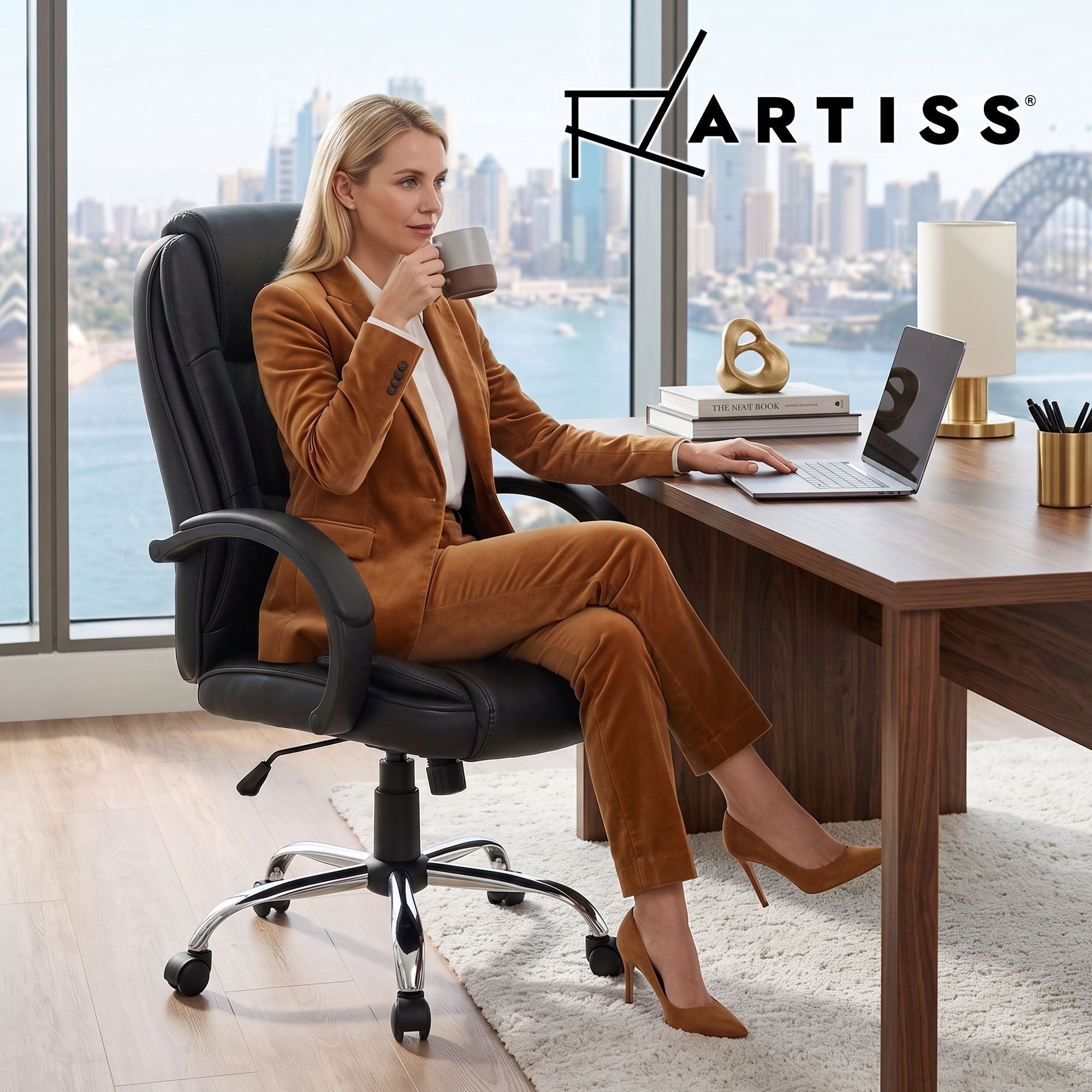 Black leather office chair with armrests, chrome base, and swivel casters