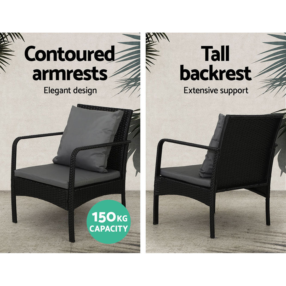 High-back outdoor wicker armchair with gray cushion and contoured armrests
