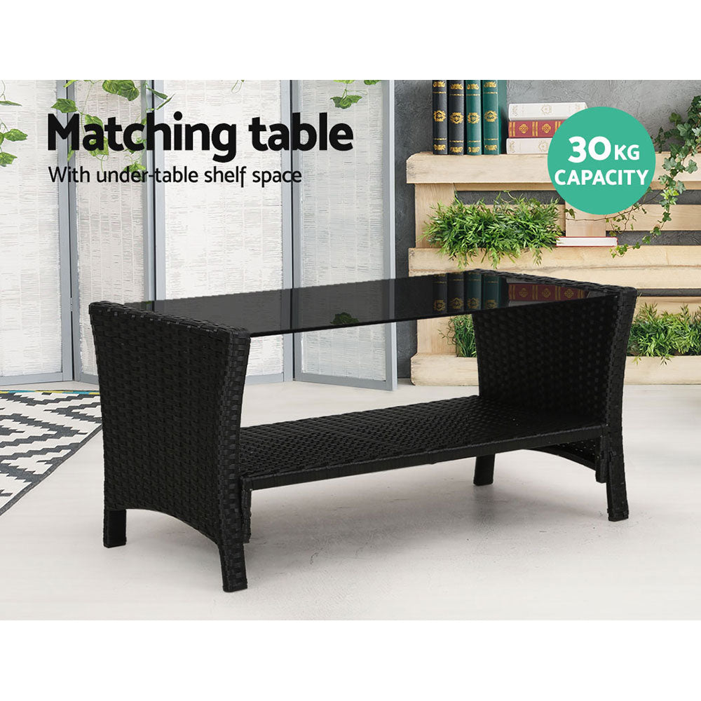 Wicker coffee table with glass top and under-table shelf, dark frame