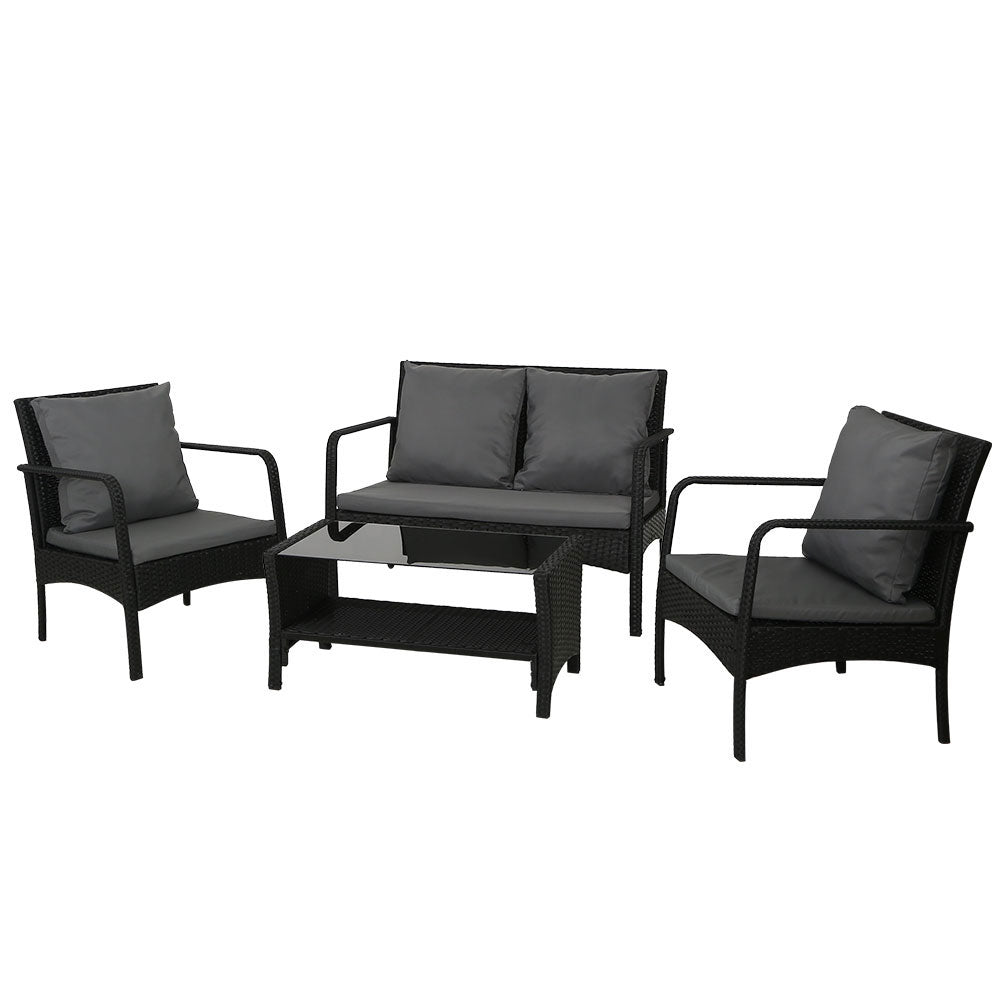 Outdoor wicker sofa set with gray cushions, loveseat, two armchairs, and glass-top table