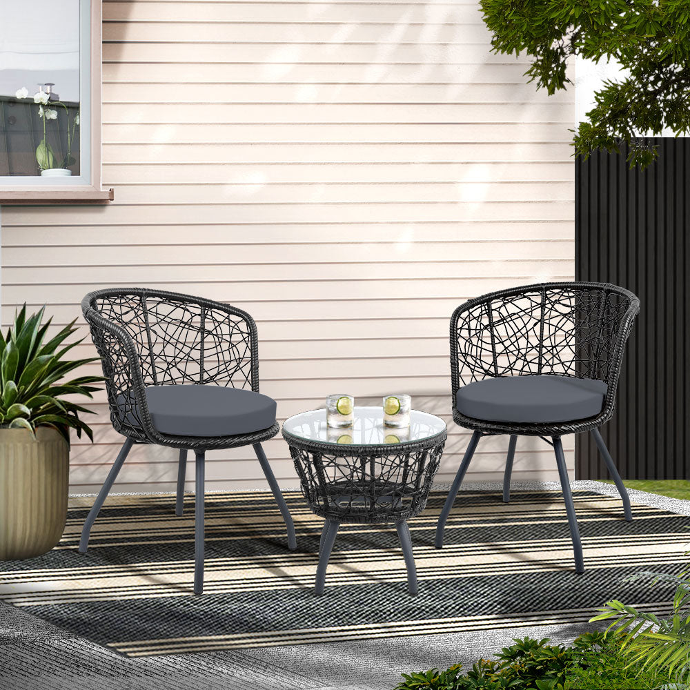 Outdoor bistro set: two black woven chairs with gray cushions and a round table