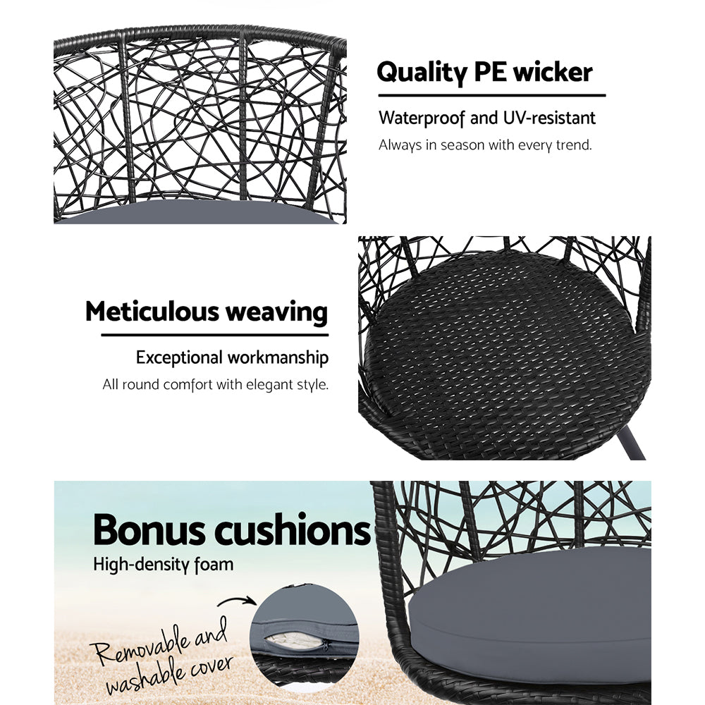 Black woven wicker chair with gray seat cushion and patterned back