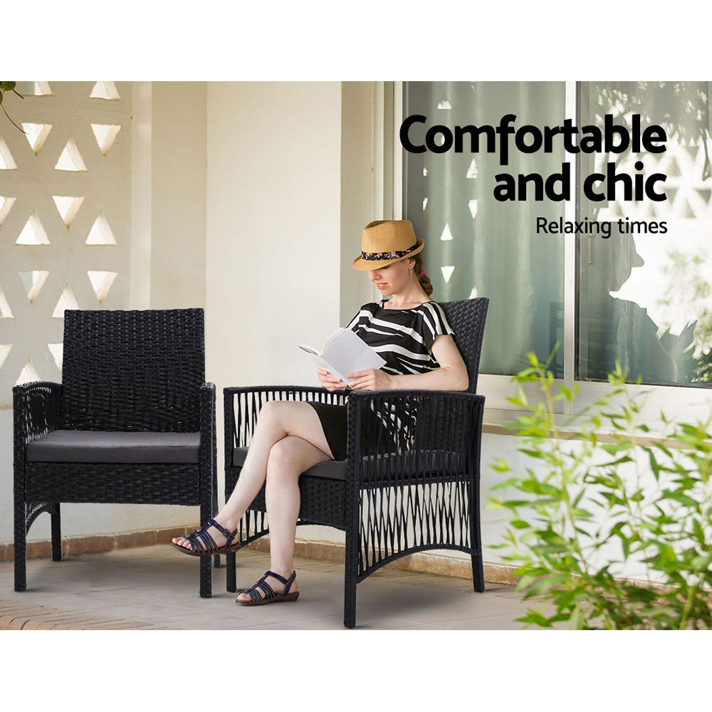 Outdoor lounge chair with dark woven frame and gray seat cushion for patio seating
