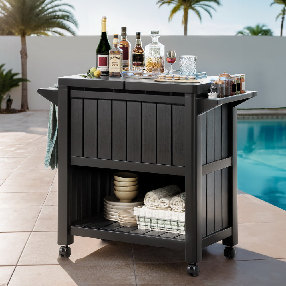 Black outdoor cooler storage cart with drinks on top and open storage compartments