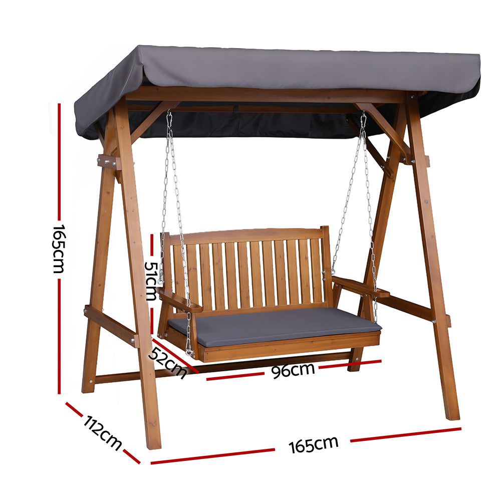 Outdoor wooden swing bench with canopy, dark gray cushions, and chain suspension