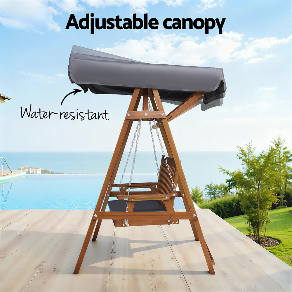 Outdoor wooden swing bench with adjustable canopy cover and dark gray seat cushion