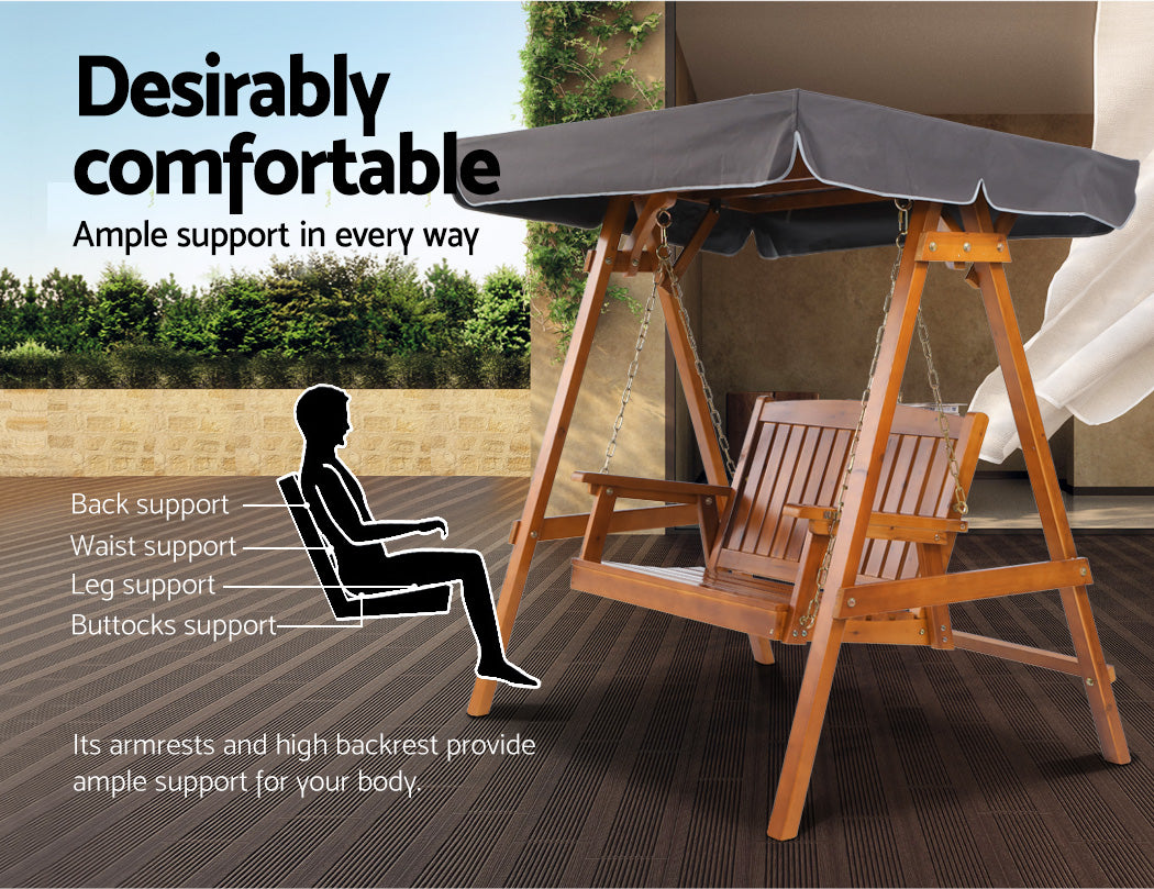 Outdoor wooden swing bench with canopy and dark gray cushion, with chain suspension