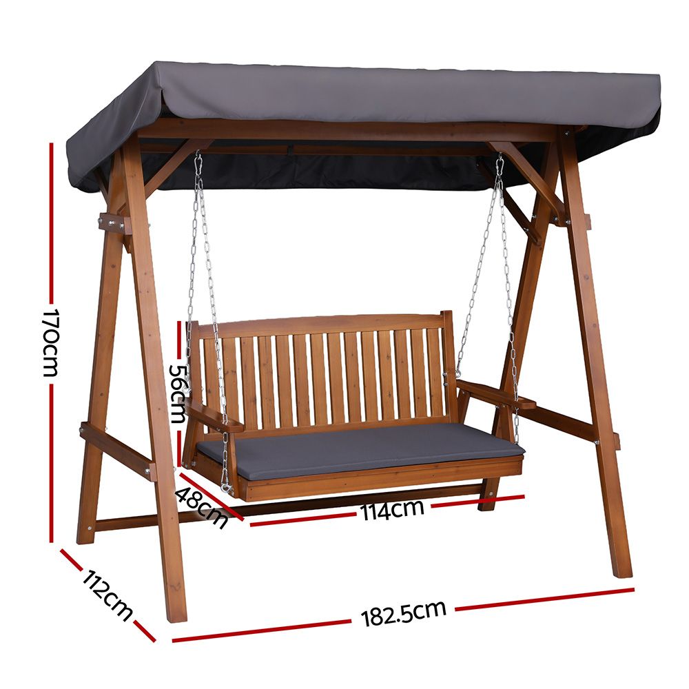 Outdoor wooden swing chair bench with gray canopy, wooden slat back, and seat cushion