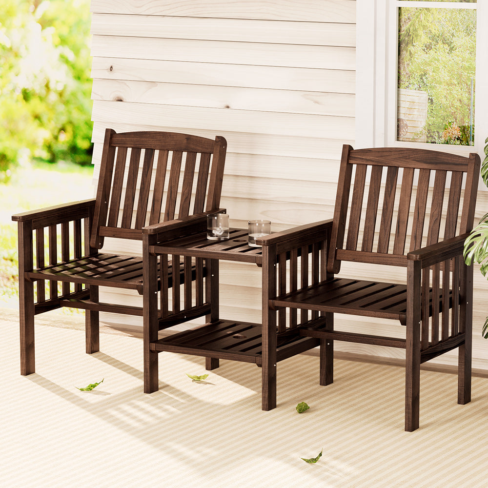 Outdoor wooden patio seating set with two armchairs and center table with drink glasses