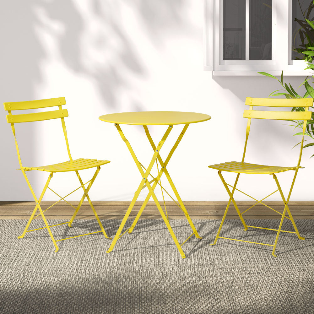 Yellow steel bistro set with round table and two folding chairs, X-frame legs