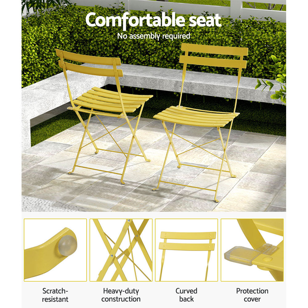 Yellow folding bistro chairs with slatted seats and backs, steel cross-braced frames