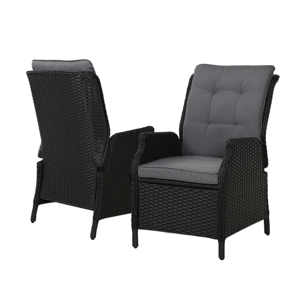 Pair of outdoor wicker recliner chairs with dark textured weave and light gray cushions