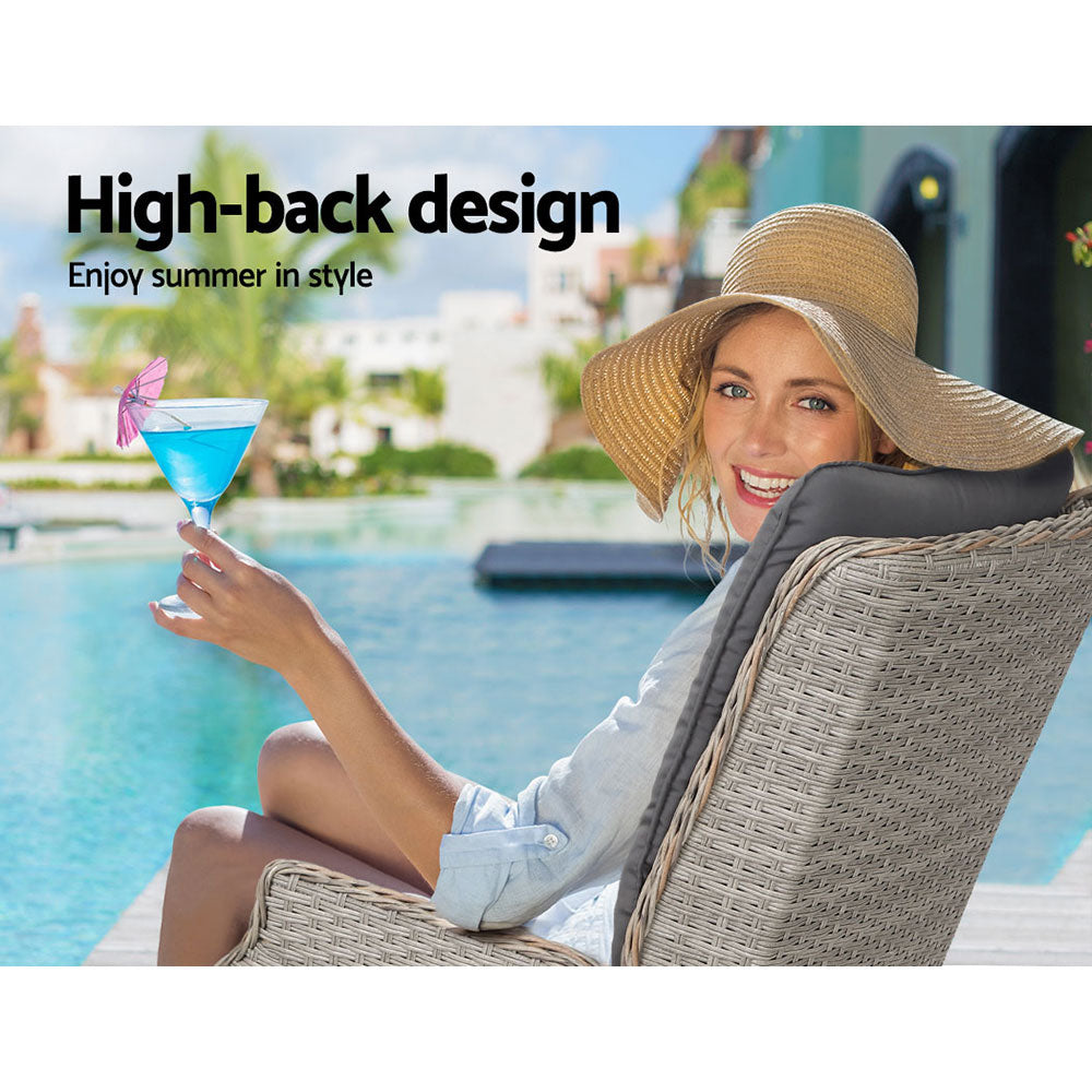 High-back outdoor wicker recliner chair with grey seat cushion for lounging
