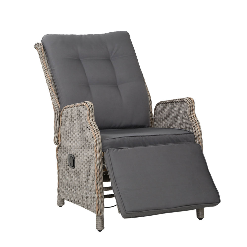 Outdoor reclining lounge chair with grey cushions and woven wicker arms
