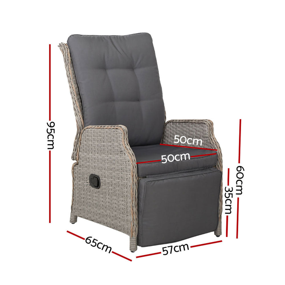 Outdoor recliner chair with gray cushion and wicker frame, footrest extended side view