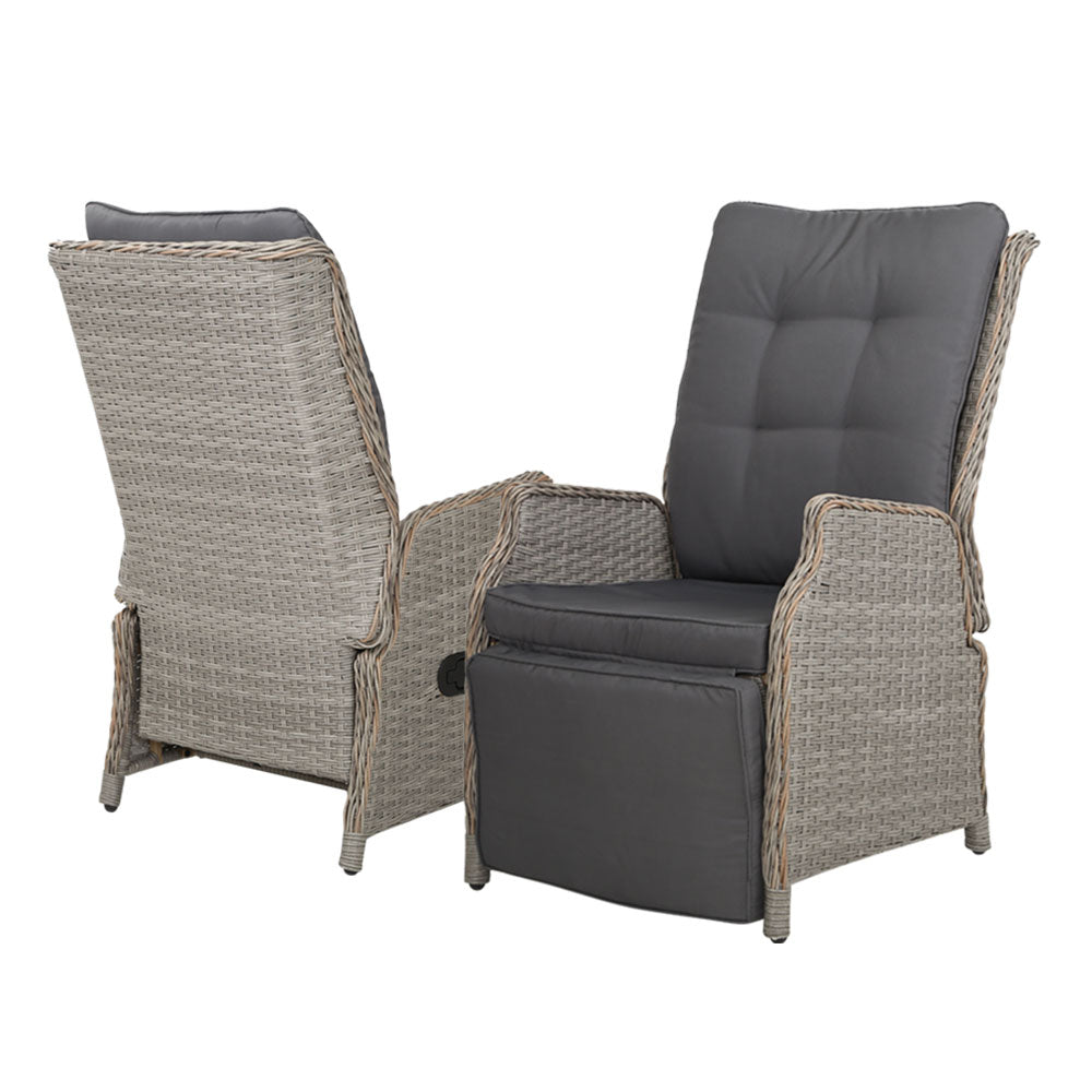 Pair of outdoor recliner chairs with tall gray backrests and woven wicker sides