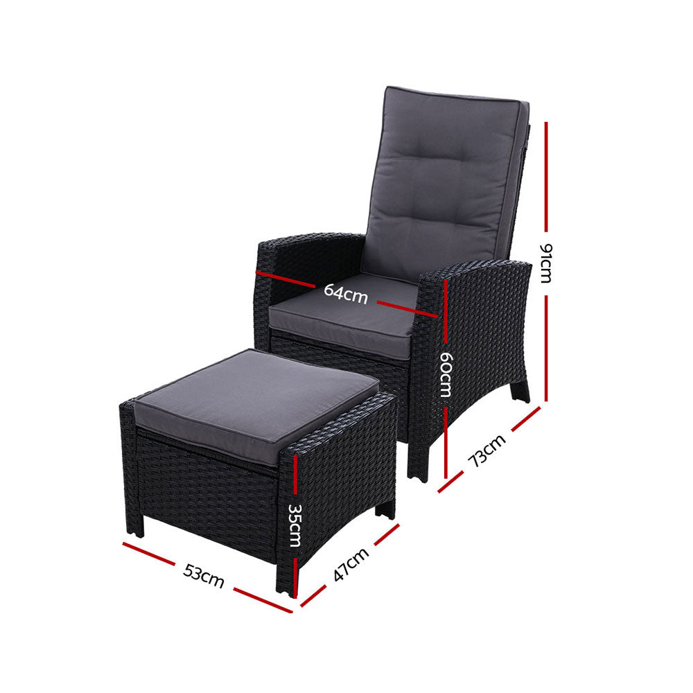 Adjustable outdoor recliner chair with black wicker frame and gray padded seat and footrest