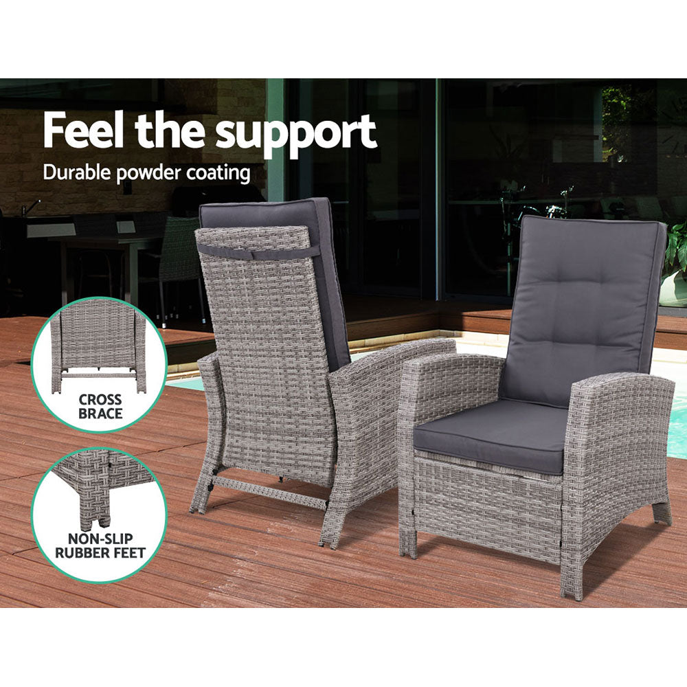 Outdoor wicker recliner chairs with grey cushions, arched armrests, and supportive frame