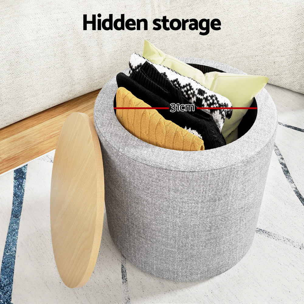 Grey round storage ottoman with open lid showing hidden interior storage space.