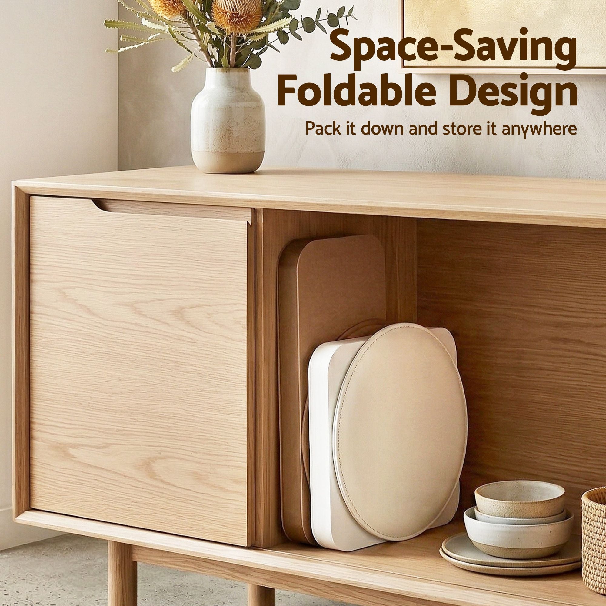 Folded accordion paper stool stored under a console, showing tan seat pad
