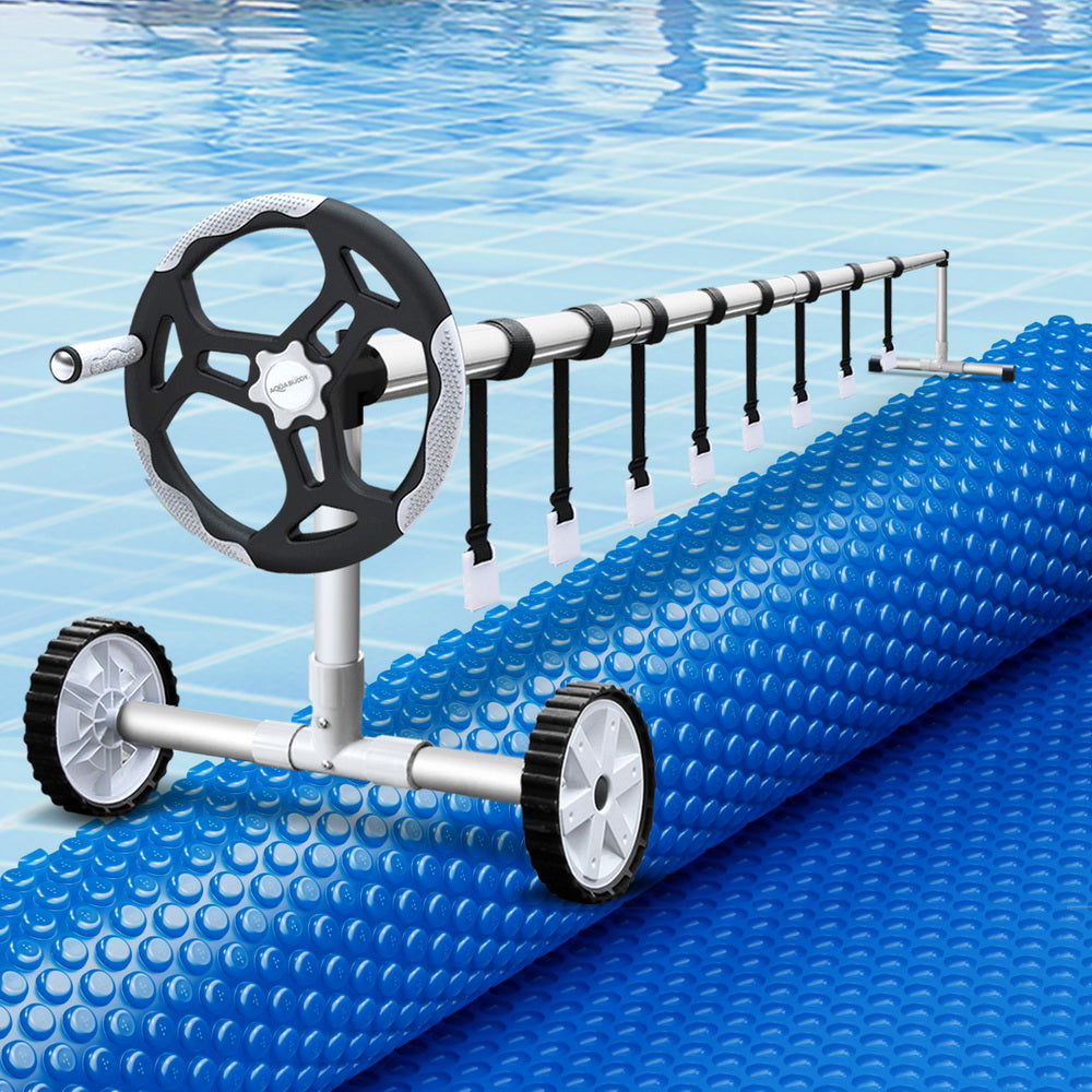 Blue solar pool cover blanket rolled on a roller system with black frame