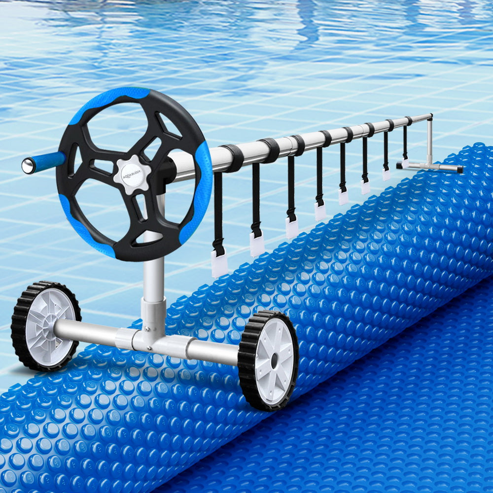 Blue solar pool cover with bubble surface and roller assembly with wheels